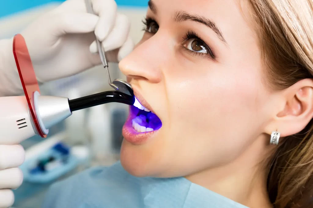 Patient getting a dental bonding treatment at the dentist