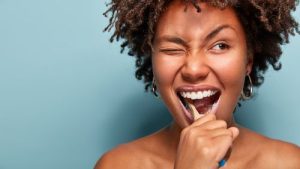 woman brushing her teeth