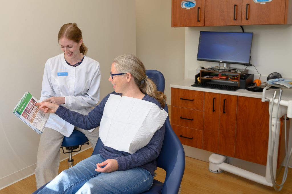 patient is shown diagram of stages of gum disease