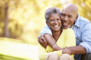 older couple sitting in a park
